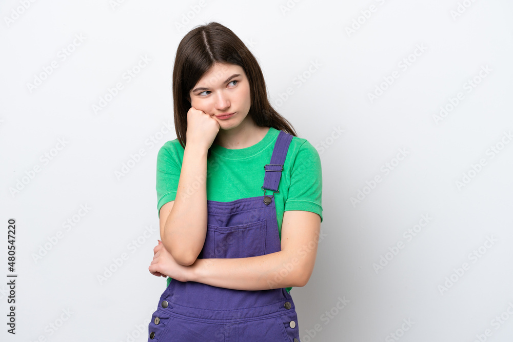 Young Russian woman isolated on blue background with tired and bored expression Young Russian woman isolated on blue background with tired and bored expression