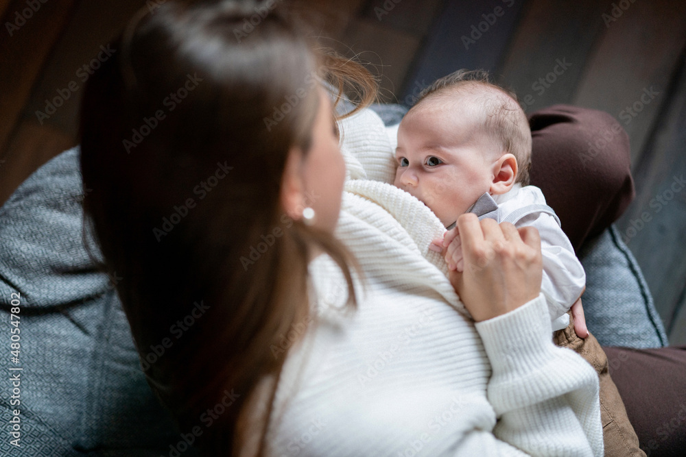 Woman breastfeeding newborn baby. Mother breastfeeding newborn boy