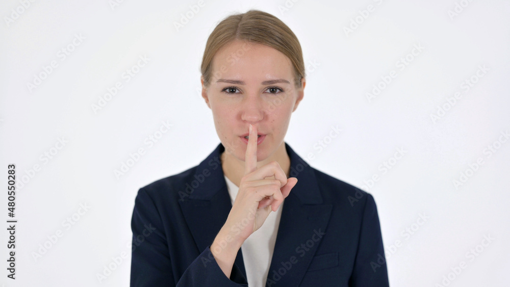 Young Businesswoman with Finger on Lips, Silence White Screen Young Businesswoman with Finger on Lips, Silence White Screen