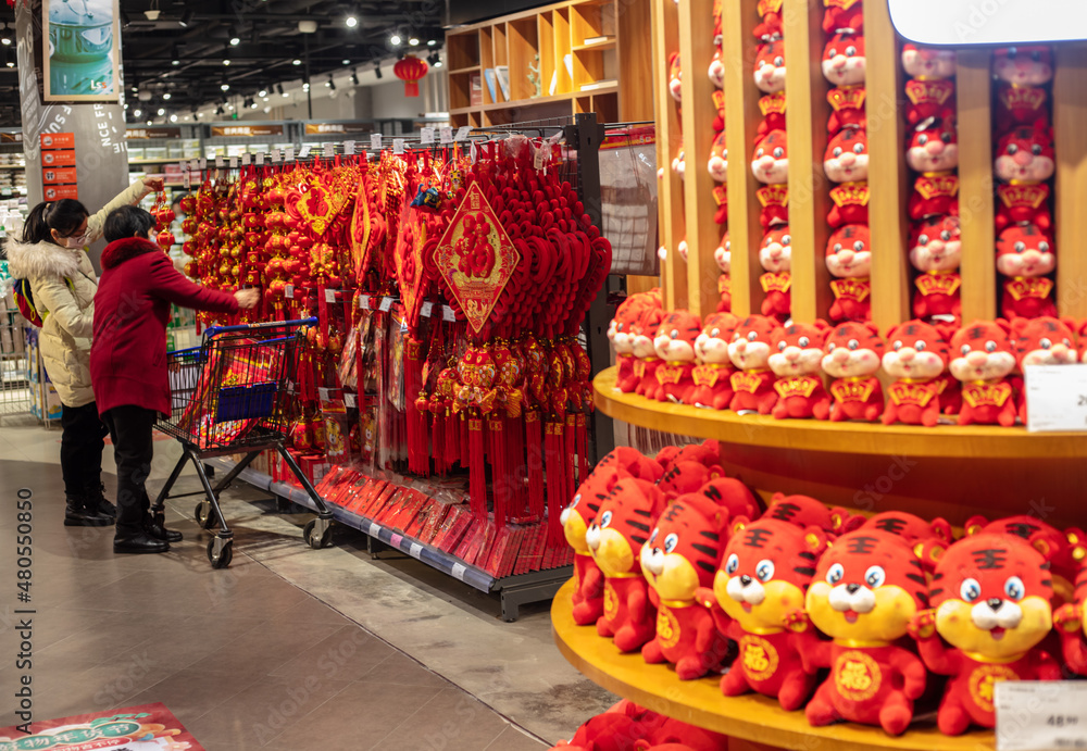 Beijing - Jan15, 2022: Chinese Year of Tiger arrives, supermarkets are attracting customers with plush toys featuring cartoon characters and accessories, 