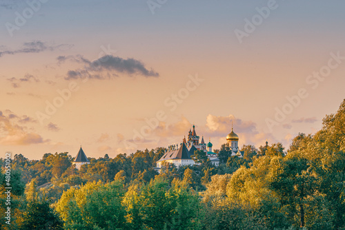 Wide angle view of Savvino-Storozhevskiy Monastyr' (Convent) with multi color trees at autumn sunset  photo