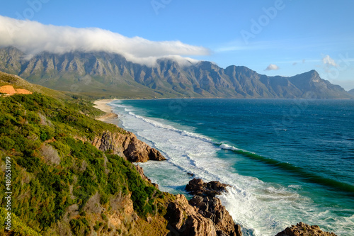 Beautiful coastal view of False bay and the Hottentots Holland mountains along the Clarence drive between Gordons Bay and Rooiels in the western cape, near Capetown in South Africa photo