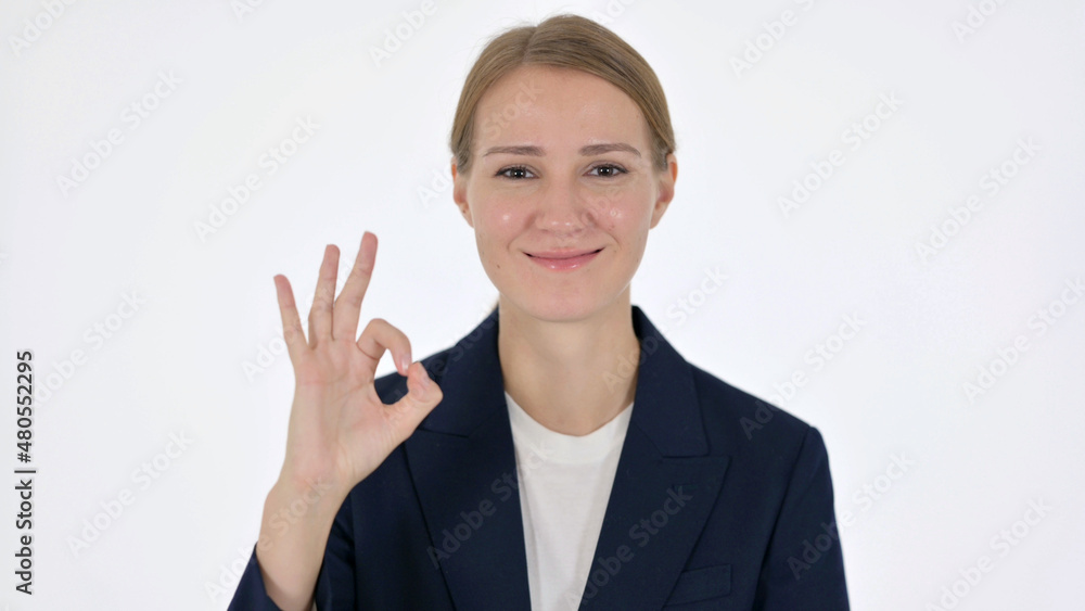 Young Businesswoman Showing Okay Sign on White Background Young Businesswoman Showing Okay Sign on White Background