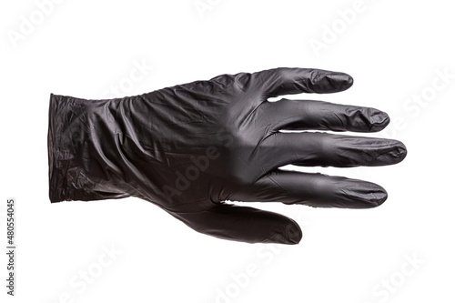 Black rubber glove worn on the hand, the outer side of the hand, isolated on white background, closeup