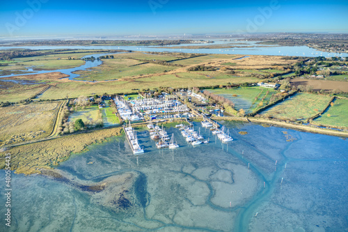 Thornham Marina full of yachts, situated in the Prinstead Estuary Channel on the Southern Coast of England, Aerial image.