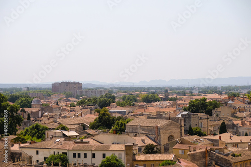 Red tiled roofs under the hot sun at noon in Avignon, France. Tourist Provence. Copy space. 