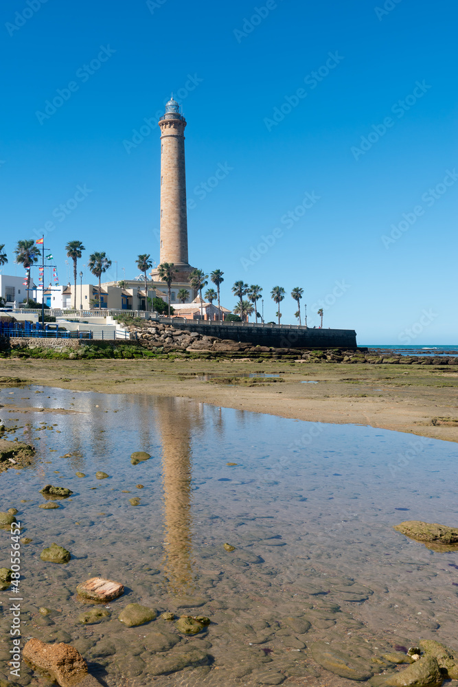 Fototapeta premium A light house and its reflection at noon in the south of Spain