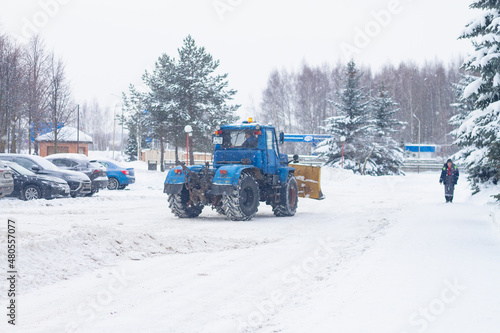 2022 01 05 Russia Kostroma Blue Bulldozer cleans the road from snow in winter