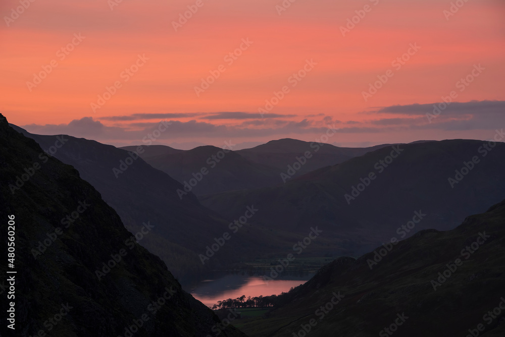 Stunning colorful landscape image of view down Honister Pass to Buttermere from Dale Head in Lake District during Autumn sunset