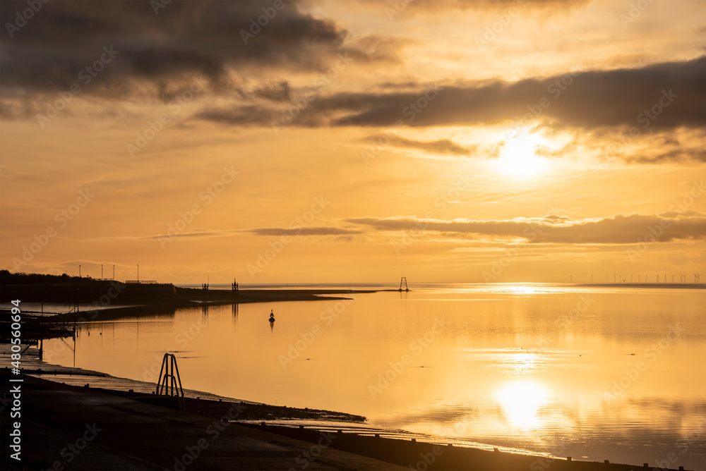 Beautiful sunset landscape image of Solway Firth viewed from Silloth during stunning Autumn sunset with dramatic sky and cloud formations Beautiful sunset landscape image of Solway Firth viewed from Silloth during stunning Autumn sunset with dramatic sky and cloud formations