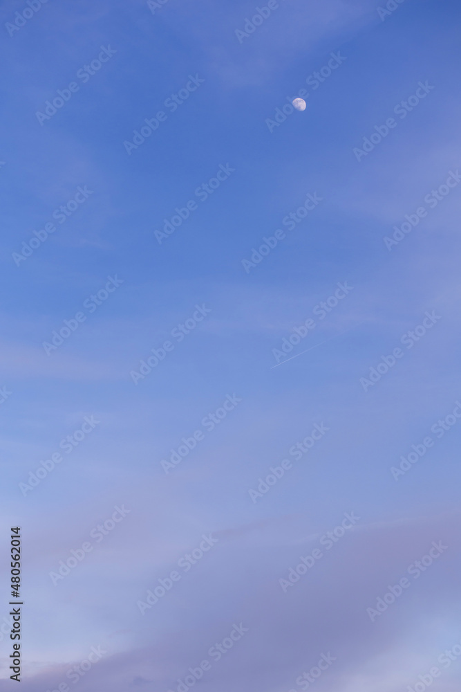 Beautiful blue sky with white and grey cirrus clouds and little moon abstract background texture
Beautiful blue sky with white and grey cirrus clouds and little moon abstract background texture