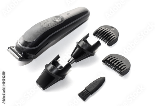 A set of the cordless electric hair clipper isolated on the white background 