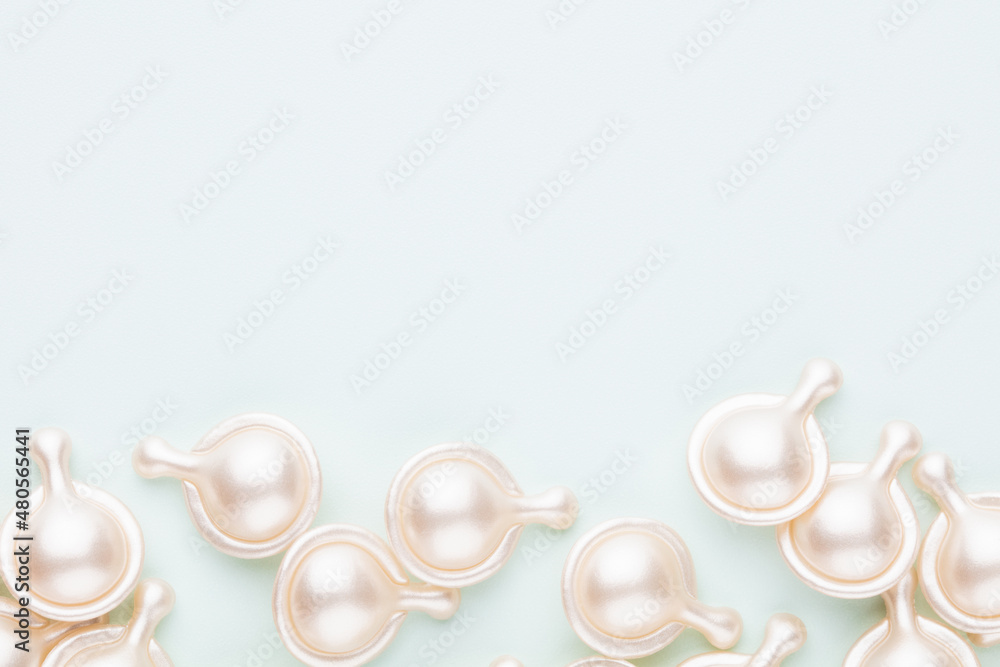 Hyaluronic acid capsule on pastel background. Hyaluronic acid capsule on pastel background.