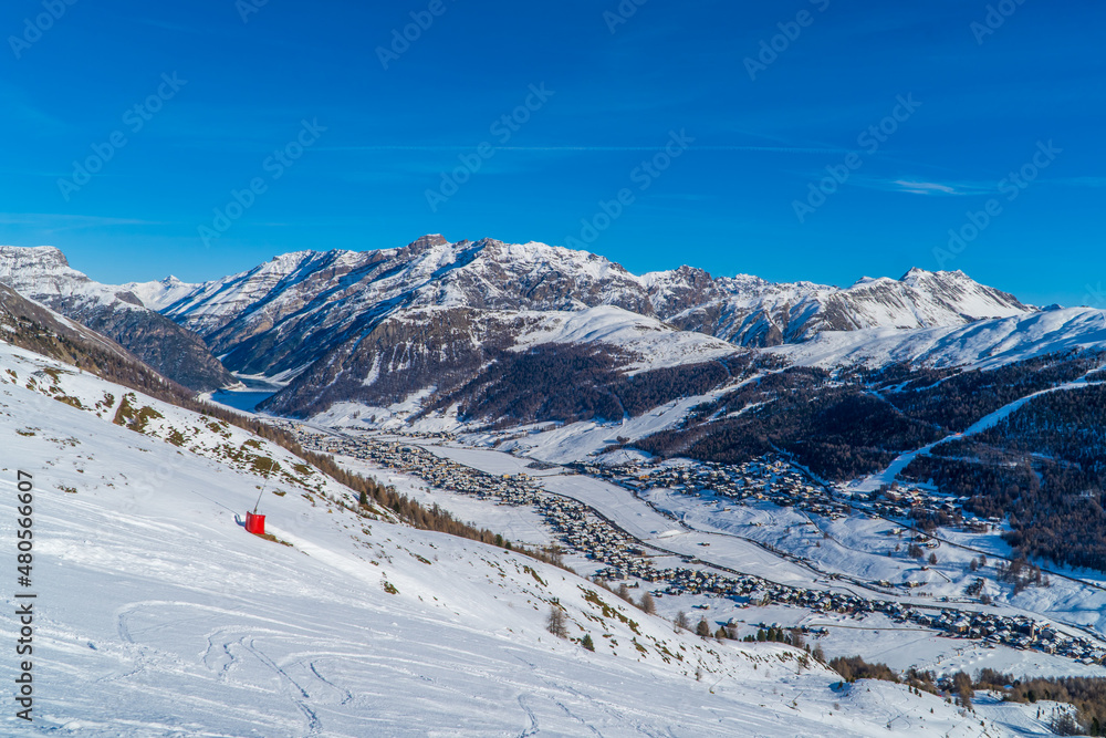 Panoramic view of the Italian Alps with the ski resort town of Livigno seen from the slopes in Livigno