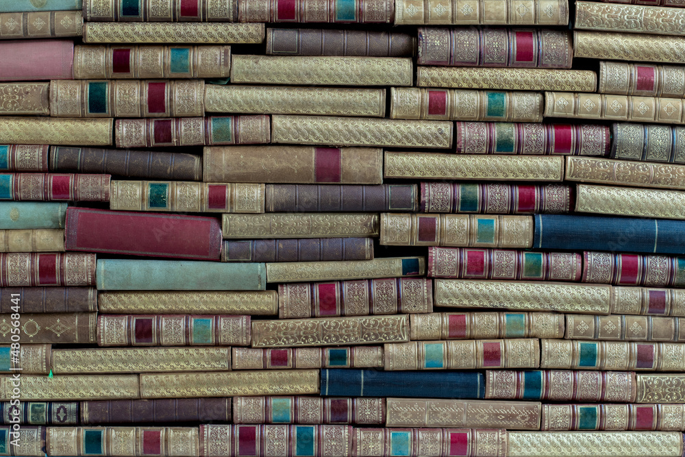 old books stacked on the shelf