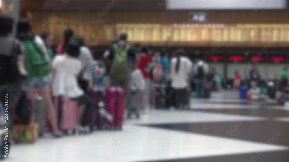 Blurred defocused an crowd of people travelers wait in the line for buy the train ticket in the Taipei main station, patience and claustrophobic travel Blurred defocused an crowd of people travelers wait in the line for buy the train ticket in the Taipei main station, patience and claustrophobic travel