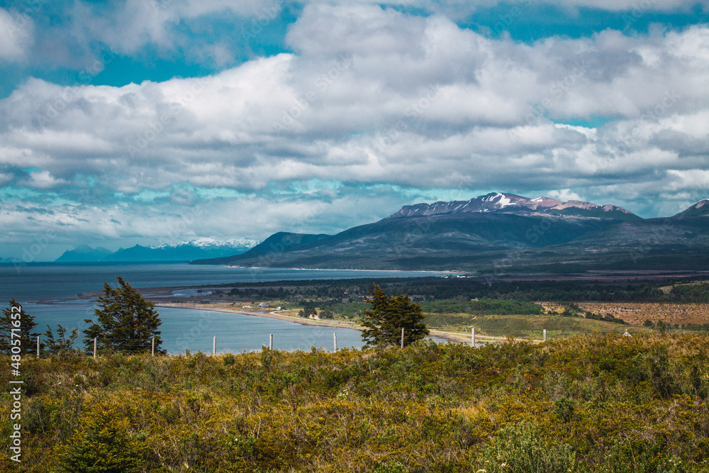 view of a mountainous area with a lake on a cloudy summer day in Chilean Patagonia