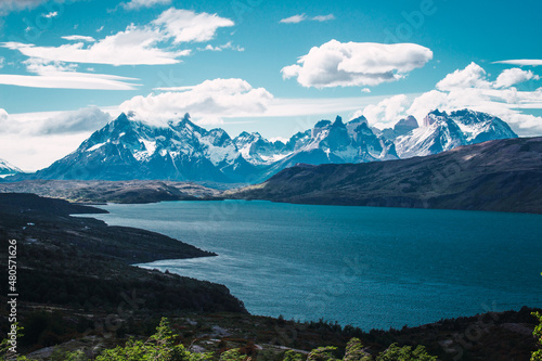 View of a mountain lake with snowy peaks in the background in the Chilean Patagonia area 