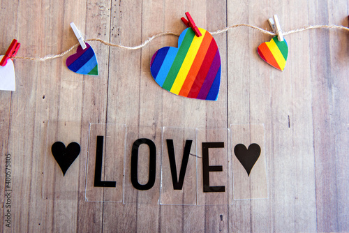 Valentine's day concept, colorful hearts (LGBT) on wooden table
