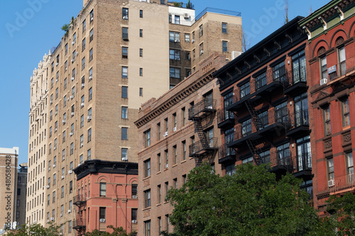 Row of Old Brick Apartment Buildings in the East Village of New York City with Fire Escapes