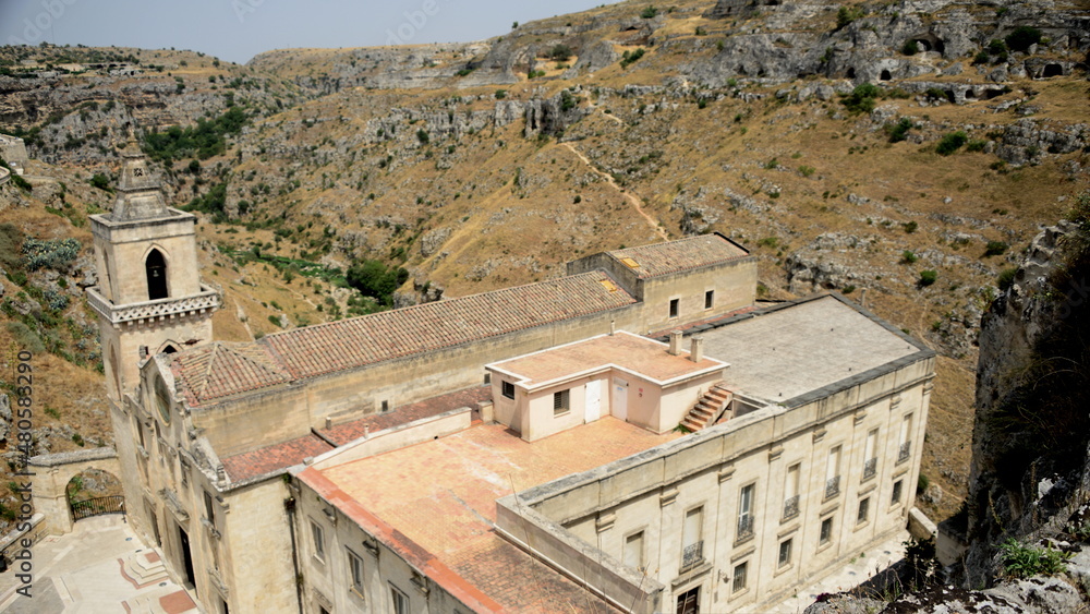 Obraz premium ITALY-Matera is a city located on a rocky outcrop in Basilicata, in Southern Italy. It includes the Sassi area, a complex of Cave Houses carved into the mountain