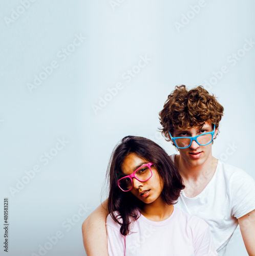 best friends teenage girl and boy together having fun, posing emotional on white background, couple happy smiling, lifestyle people concept, blond and brunette multi nations