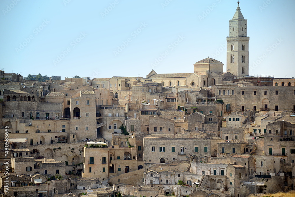 Fototapeta premium ITALY-Matera is a city located on a rocky outcrop in Basilicata, in Southern Italy. It includes the Sassi area, a complex of Cave Houses carved into the mountain
