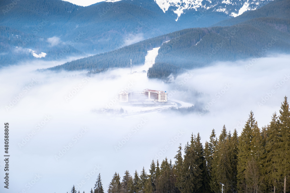 ski resort hotel in mist mountains landscape ski resort hotel in mist mountains landscape