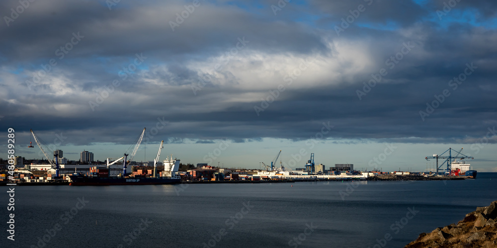Reykjavik, Iceland - June 09, 2021: 
Ships and cranes in Reykjavik Harbour, on a bright sunny day. 