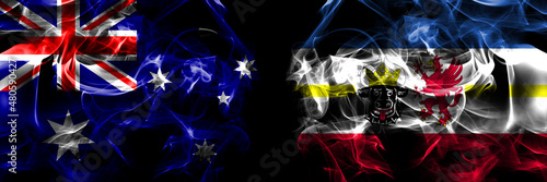 Flags of Australia, Australian vs Germany, Mecklenburg Western Pomerania, state. Smoke flag placed side by side on black background photo