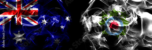 Flags of Australia, Australian vs Japan, Japanese, Biratori, Hokkaido, Hidaka, Subprefecture. Smoke flag placed side by side on black background photo