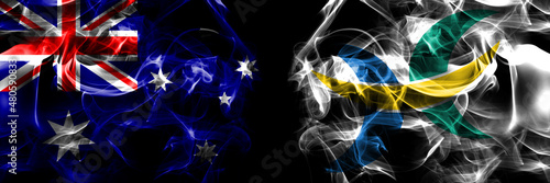 Flags of Australia, Australian vs Japan, Japanese, Hokuto, Hokkaido, Oshima, Subprefecture. Smoke flag placed side by side on black background photo