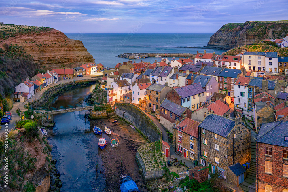 Staithes is a seaside village in the Scarborough Borough of North Yorkshire, England. Captain Cook lived and worked here as a grocer's apprentice.