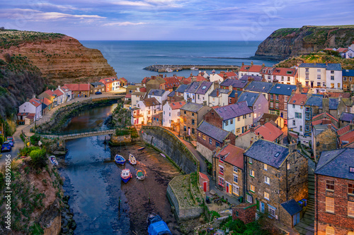 Staithes is a seaside village in the Scarborough Borough of North Yorkshire, England. Captain Cook lived and worked here as a grocer's apprentice.