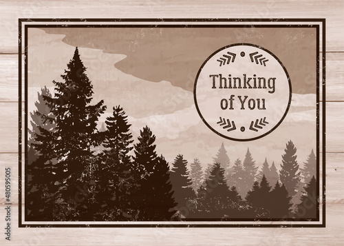 Thinking of you greeting card. Masculine scenic view of the forest in sepia colors. Distressed Thinking of you badge icon on a wooden plank and forest background