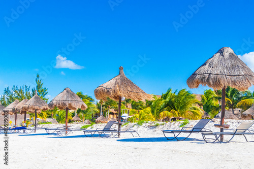 Beautiful Holbox island beach sandbank panorama palapa sun loungers Mexico. photo