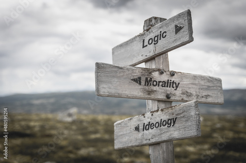 logic morality ideology text on wooden sign outdoors. photo