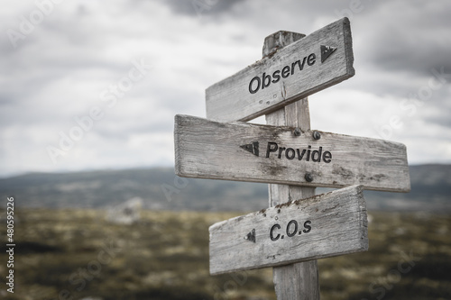 observe provide c.o.s. text on wooden sign outdoors.