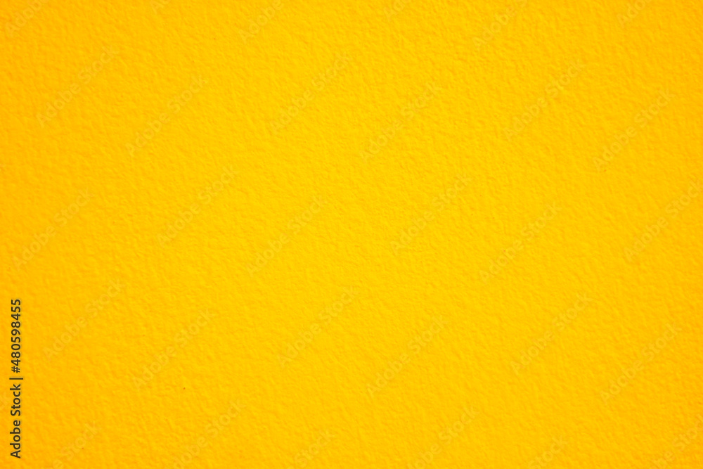 Obraz premium Yellow concrete wall texture with empty copy space