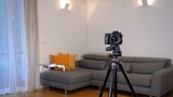 A photographer uses a drone for surveying, photography and video of apartment and building interiors - real estate and home staging for sell the home - new 4k aerial technology