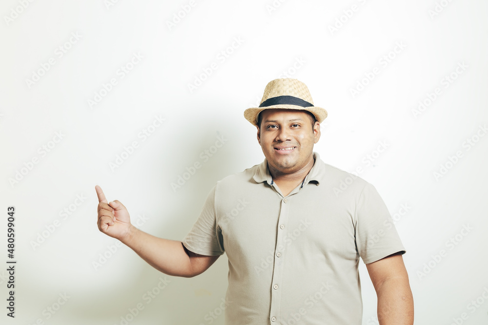 hispanic man with hat pointing his finger very happy, on white background hispanic man with hat pointing his finger very happy, on white background