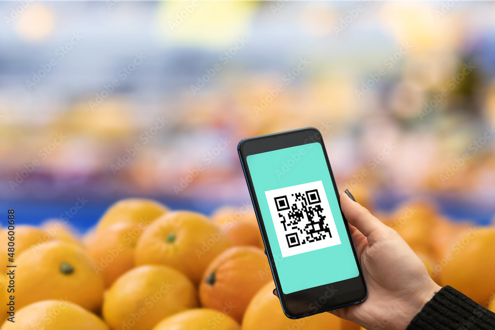 qr code of vaccination on phone to visit grocery store,hand shows a ...