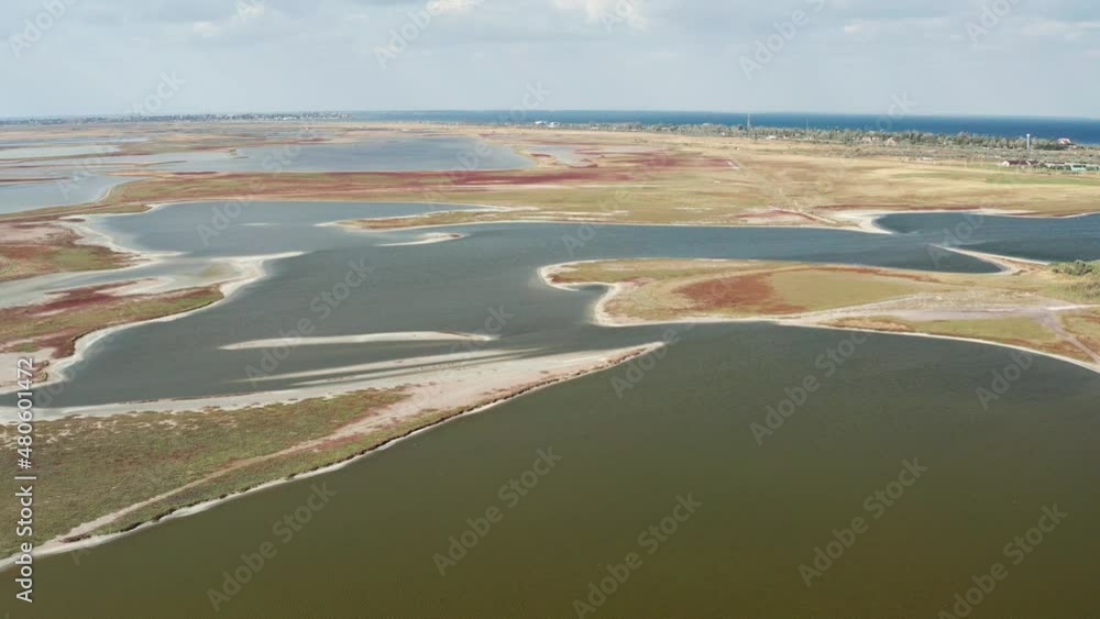 Beautiful flight in summer over salt lakes. Dry lakes. Green grass. Beautiful flight in summer over salt lakes. Dry lakes. Green grass.