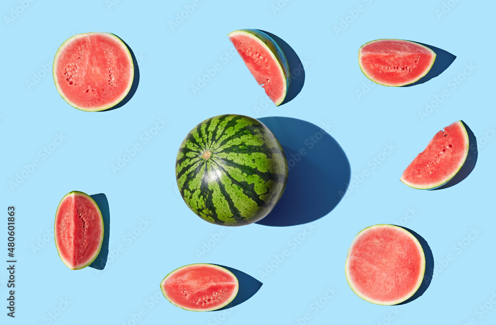 Cut watermelon on blue pastel background