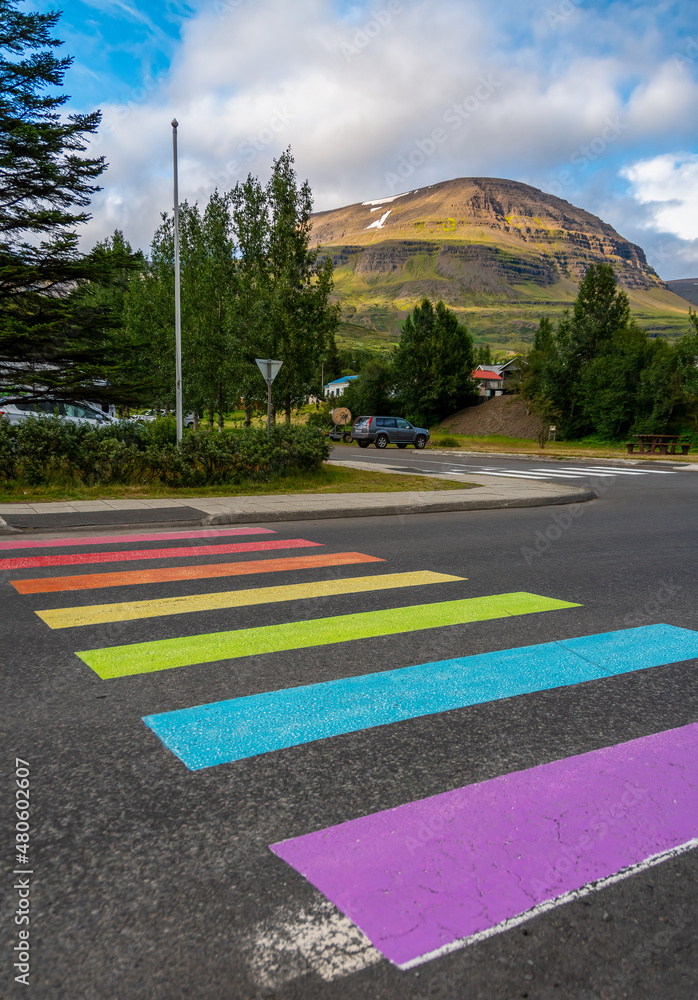 Rainbow marked crosswalk supporting equal rights for LGBT people community. Reydarfjordur - Eastfjords (Austfirðir), Iceland - obrazy, fototapety, plakaty 