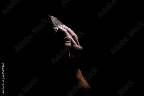 Open climbing grip on black background