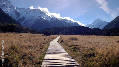 Wooden path and mountains of Mount Cook National Park, South Island, New Zealand