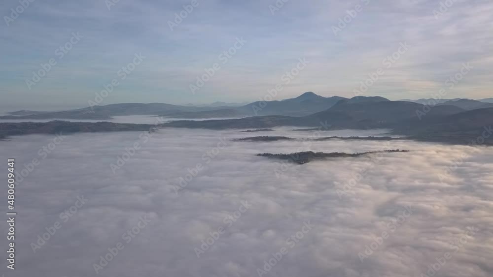 aerial view of a hilly landscape immersed in the autumn mist aerial view of a hilly landscape immersed in the autumn mist