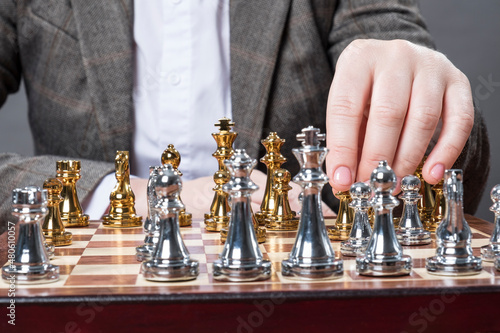 A man plays chess at the table.