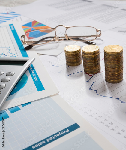 Money and business graphics on the desktop.


